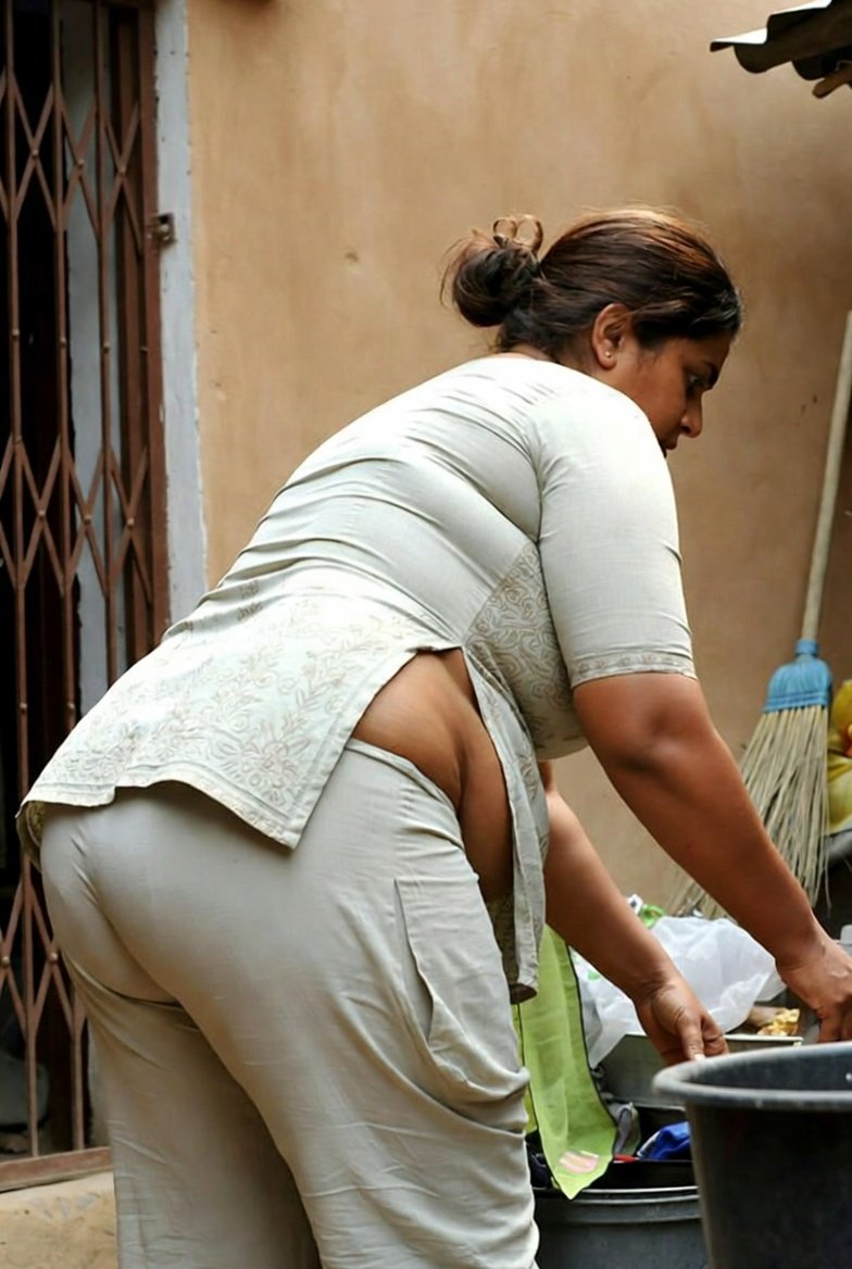 Curvy Indian aunty bending over outdoors showing her backside
