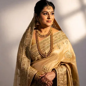 Elegant Bhabhi in Golden Saree Poses Gracefully