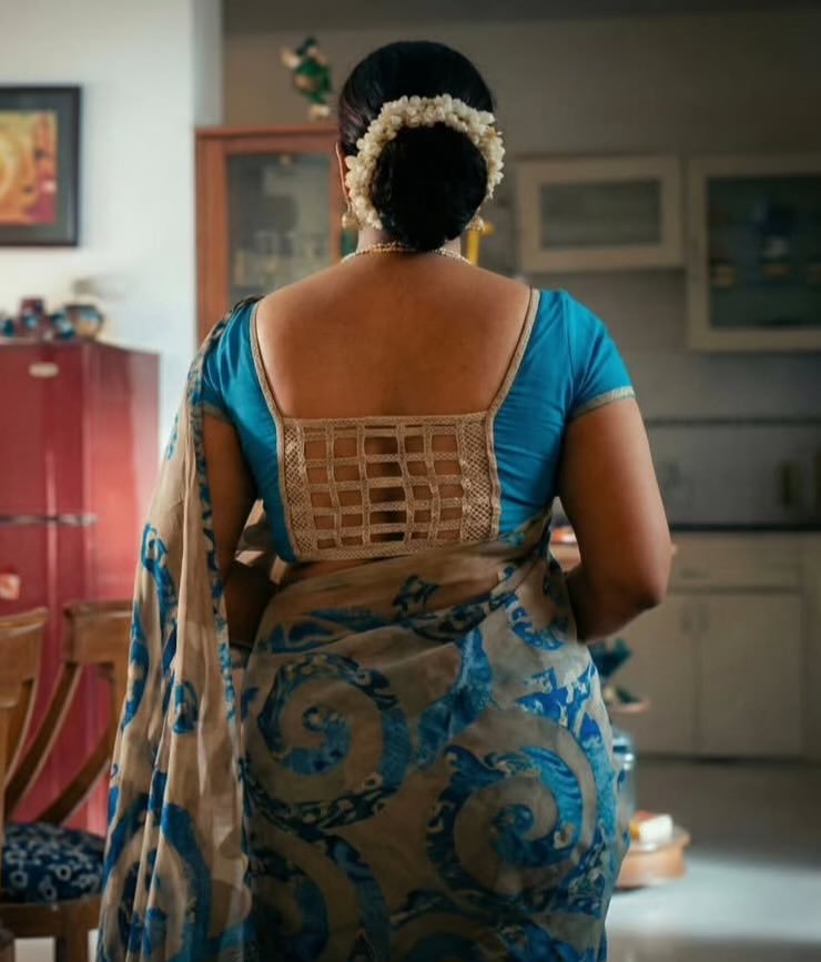 Mature Indian aunty in beautiful traditional saree posing elegantly