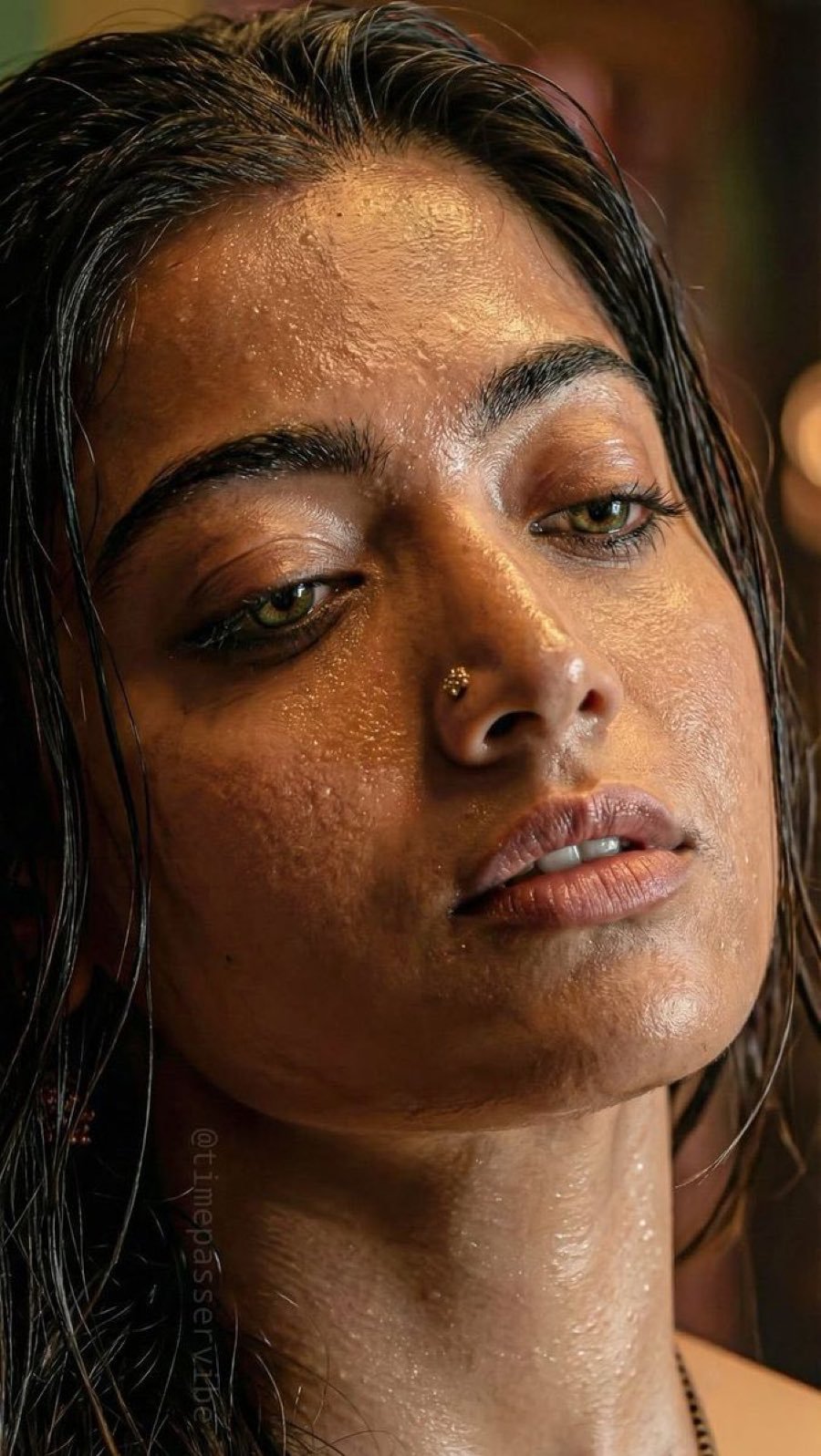 Indian bhabhi with dewy skin and wet hair posing seductively