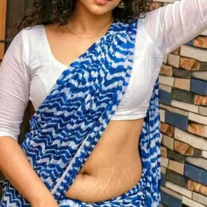 Curvy South Indian aunty in blue white saree posing confidently