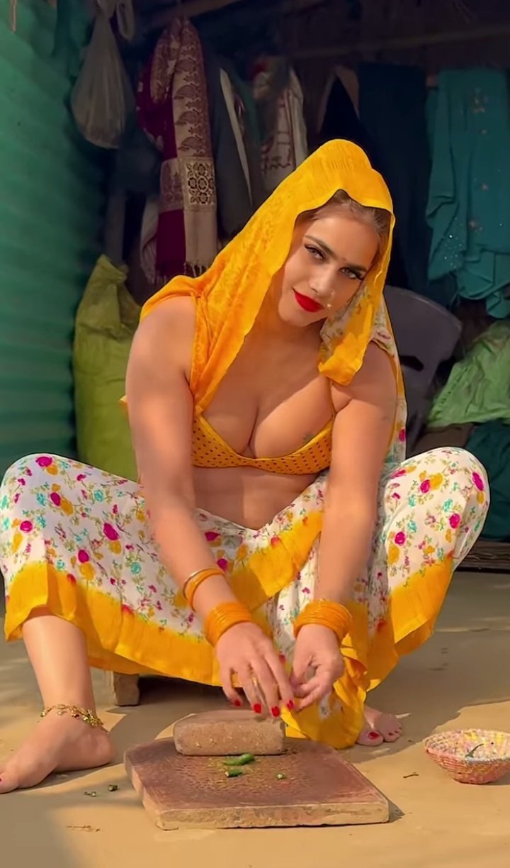 Curvy bhabhi in yellow punjabi outfit posing sensually preparing food